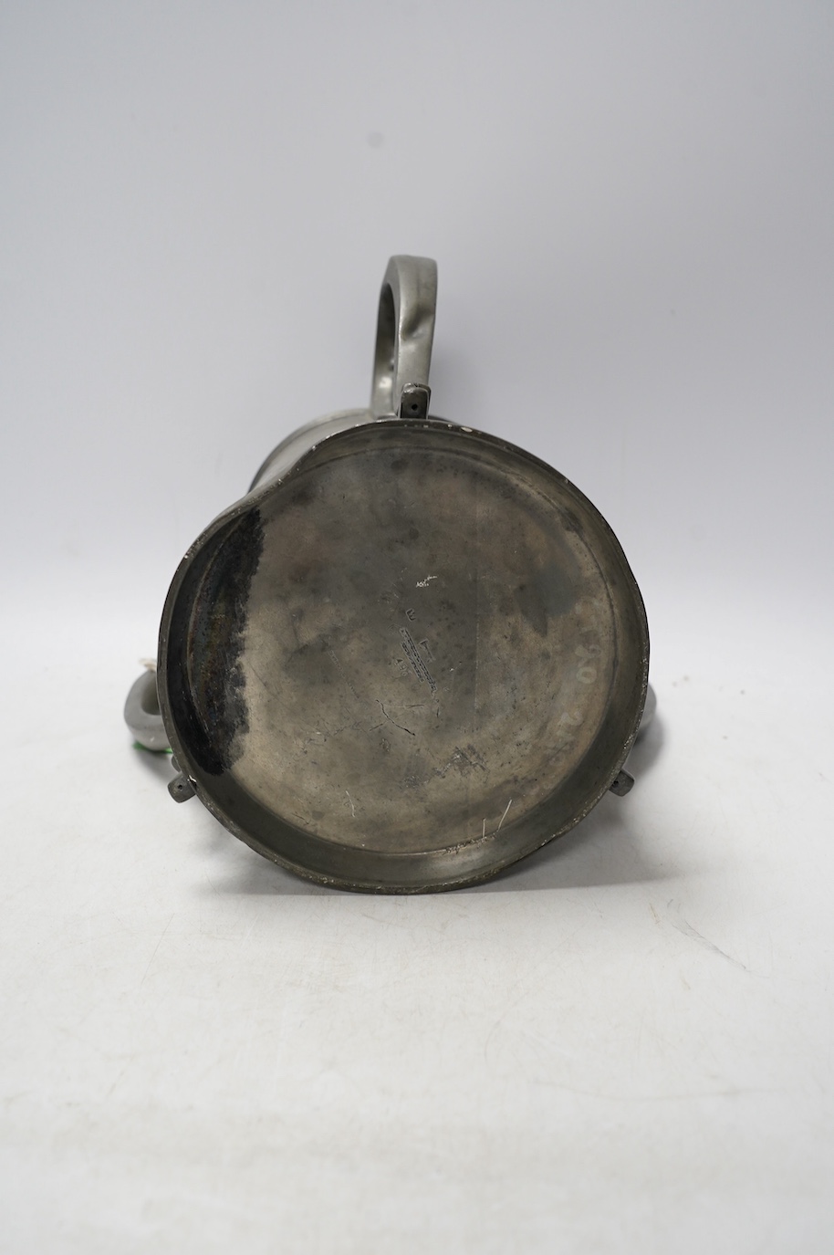 A 19th century pewter three handled rowing trophy from Caius College, 19cm. Condition - fair